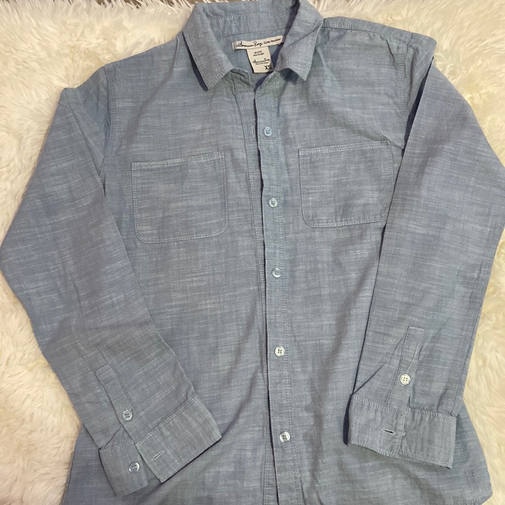 Jean like material light blue wash button up with lace like white fabric on back